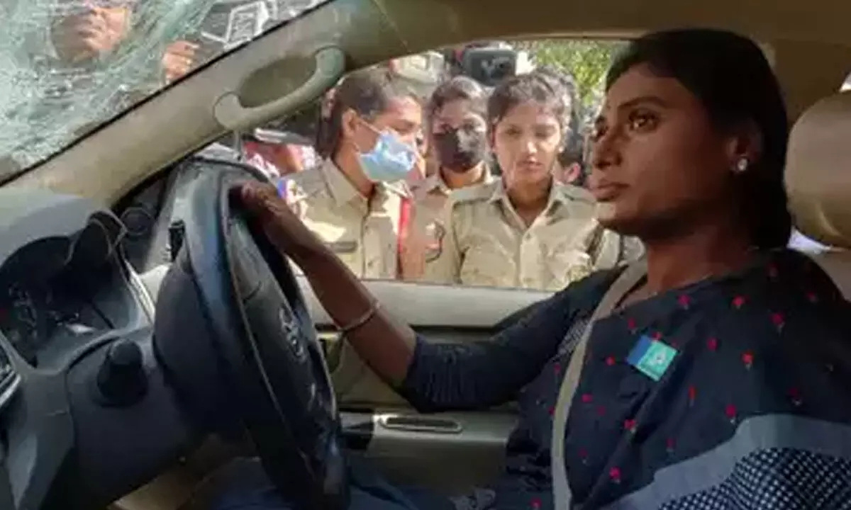 Sharmila registers novel protest, Police shift her with Crane